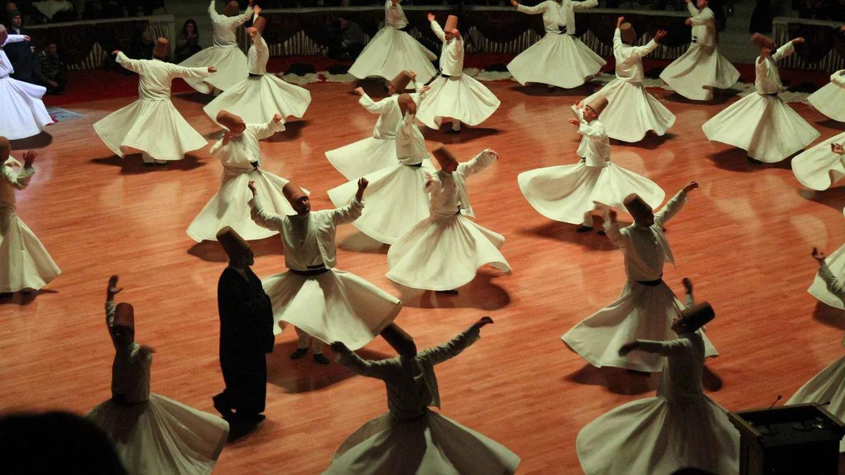Whirling dervish in white robes during a sema ceremony in Cappadocia