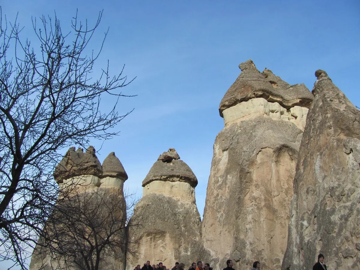 A three-headed fairy chimney with a dark basalt cap at Paşabağ Valley, Cappadocia